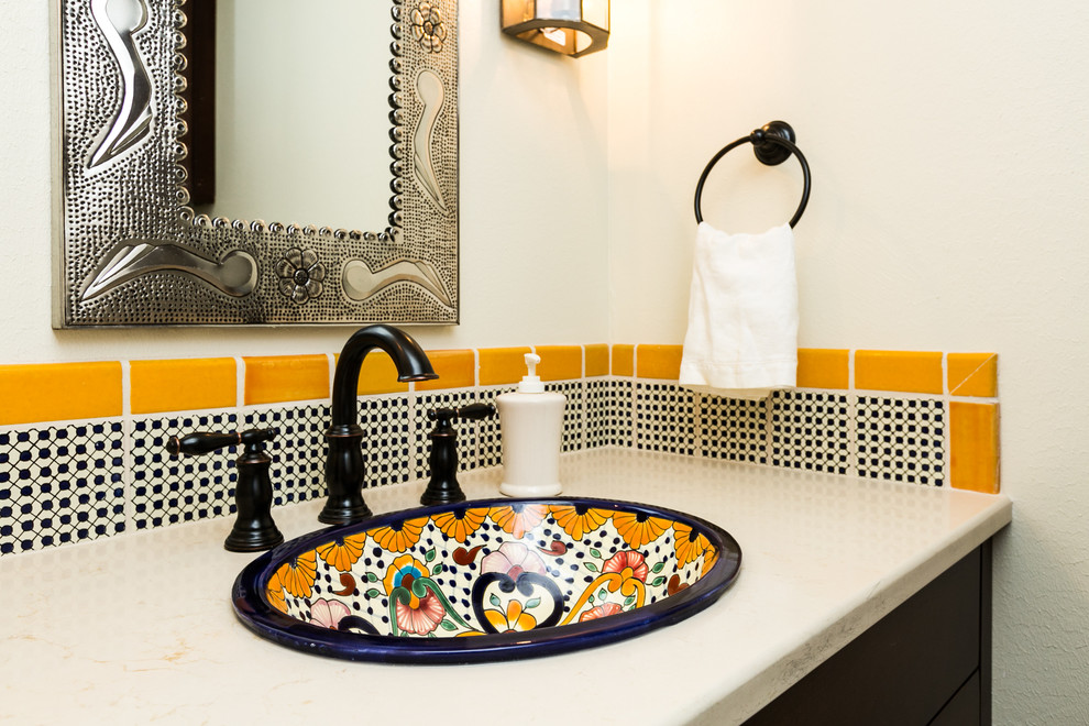 Inspiration for a small transitional 3/4 black and white tile, yellow tile and porcelain tile bathroom remodel in Albuquerque with shaker cabinets, brown cabinets, white walls, a drop-in sink and marble countertops