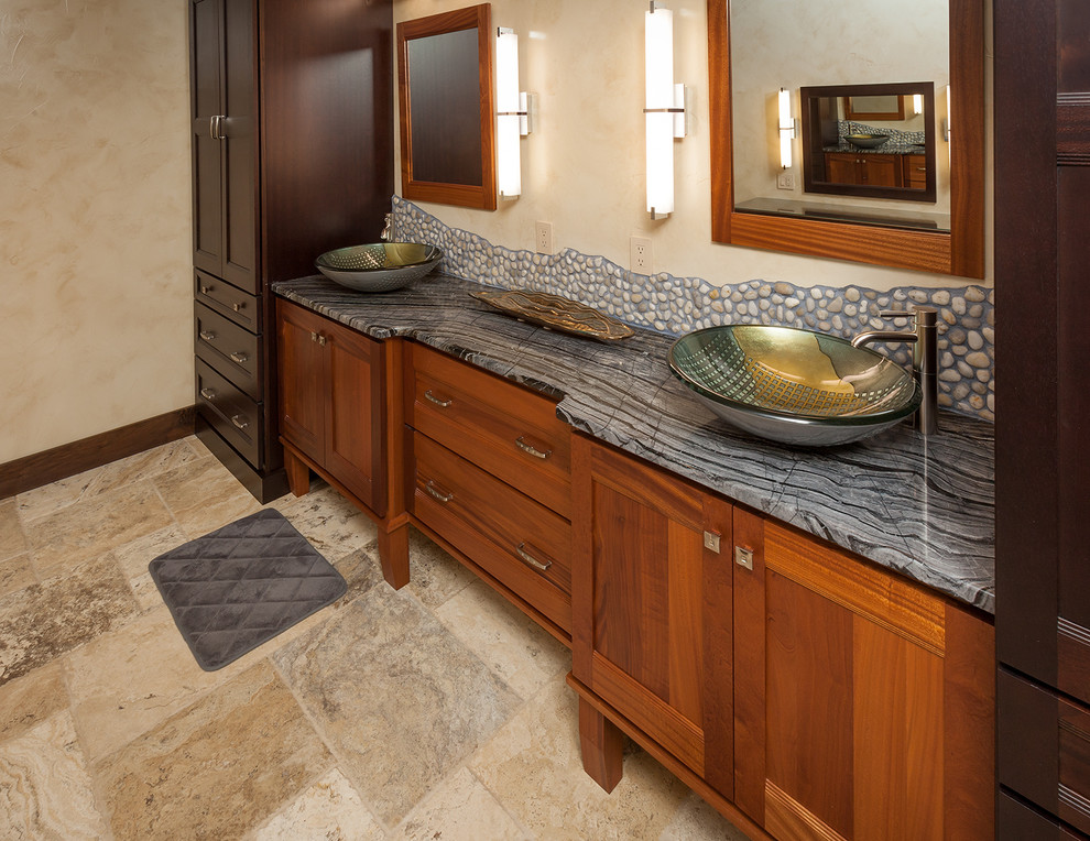Example of a large mountain style master beige tile, gray tile and pebble tile travertine floor and beige floor bathroom design in Denver with shaker cabinets, dark wood cabinets, beige walls, a vessel sink and marble countertops