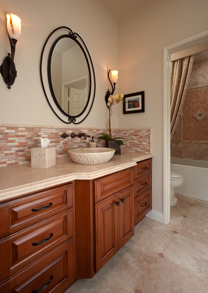Inspiration for a large timeless master white tile and ceramic tile marble floor bathroom remodel in Orange County with a drop-in sink, beaded inset cabinets, dark wood cabinets, granite countertops, a one-piece toilet and beige walls