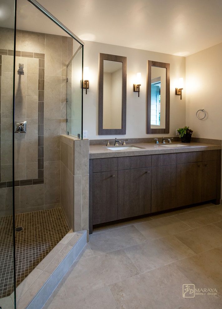 Exemple d'une douche en alcôve principale tendance en bois brun de taille moyenne avec un lavabo encastré, un placard à porte plane, un plan de toilette en calcaire, une baignoire indépendante, WC séparés, un carrelage beige, des dalles de pierre, un mur beige et un sol en marbre.