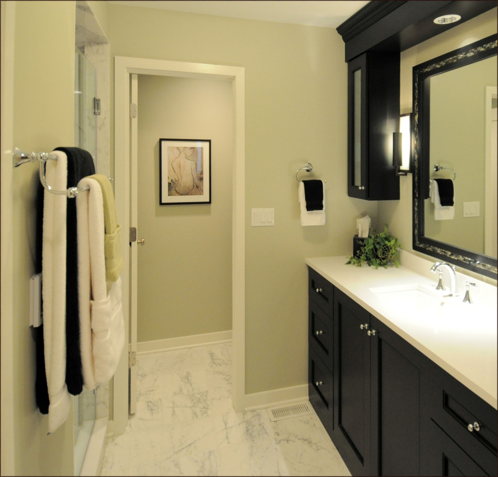 Example of a transitional master bathroom design in Chicago with an undermount sink, recessed-panel cabinets, black cabinets and green walls