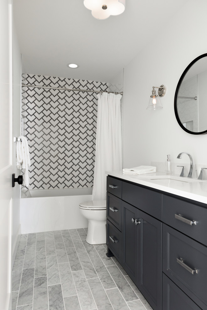Photo of a medium sized traditional ensuite bathroom in Minneapolis with shaker cabinets, white cabinets, a freestanding bath, an alcove shower, a two-piece toilet, beige tiles, mosaic tiles, beige walls, marble flooring, a submerged sink, engineered stone worktops, grey floors, a shower curtain, grey worktops, a single sink and a built in vanity unit.