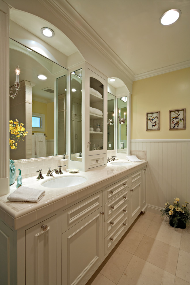 Bathroom - huge traditional white tile and ceramic tile bathroom idea in Orange County with an undermount sink, furniture-like cabinets, white cabinets and yellow walls