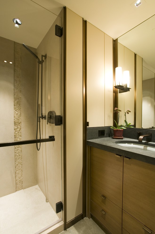 This is an example of a contemporary bathroom in Seattle with limestone tiles.