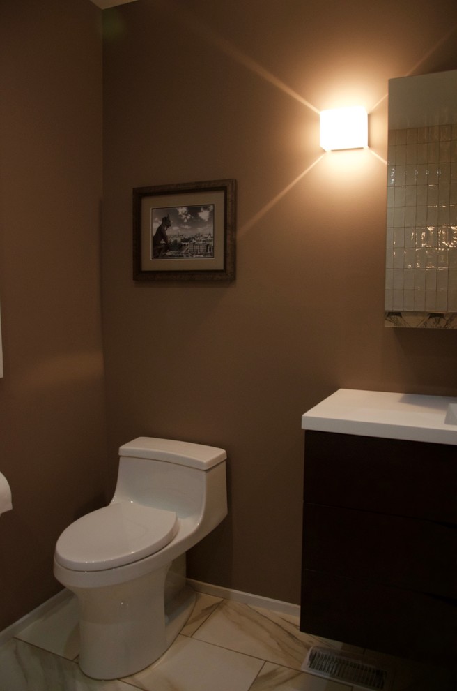 Design ideas for a medium sized contemporary cloakroom in San Francisco with ceramic tiles, brown walls, an integrated sink, flat-panel cabinets, dark wood cabinets, porcelain flooring and engineered stone worktops.