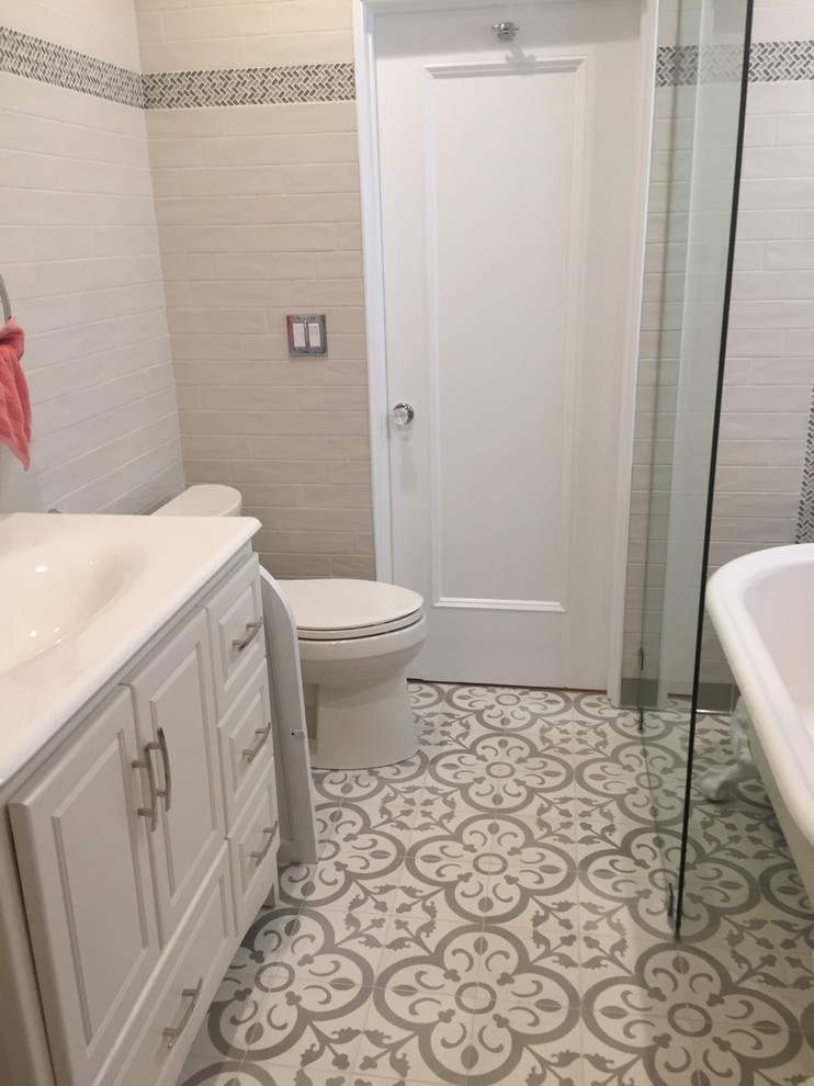 Inspiration for a medium sized mediterranean shower room bathroom in Los Angeles with freestanding cabinets, white cabinets, a claw-foot bath, a shower/bath combination, a one-piece toilet, grey tiles, metro tiles, grey walls, cement flooring, an integrated sink, tiled worktops, grey floors and an open shower.