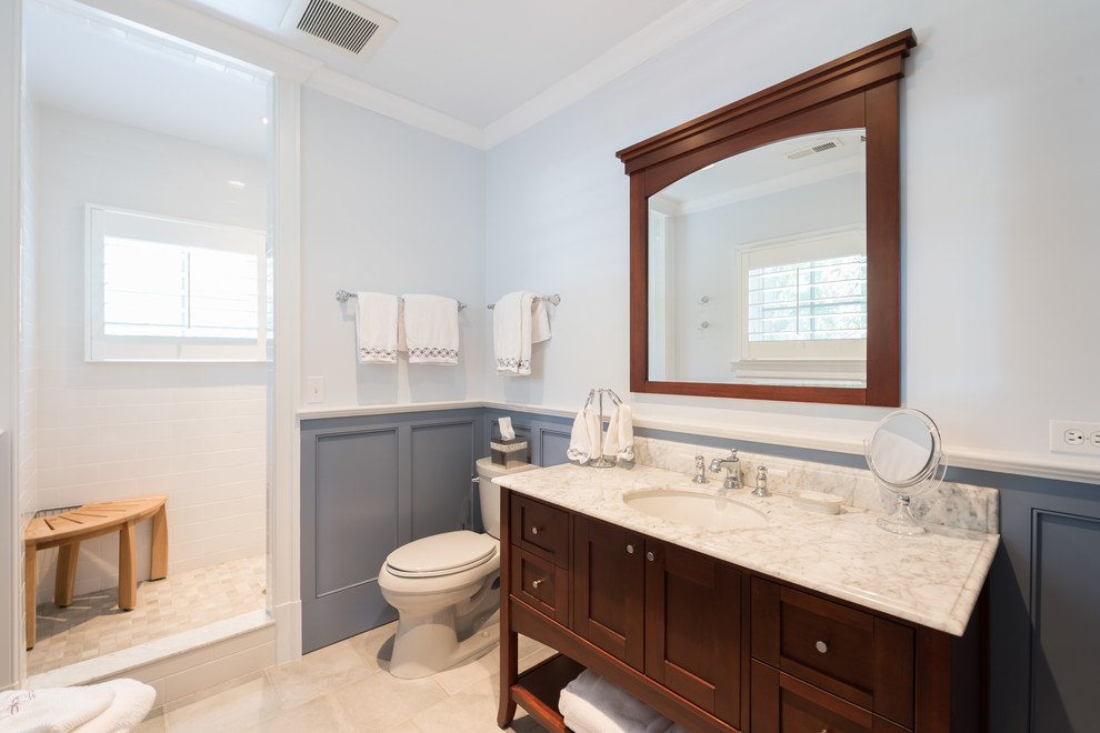 This is an example of a medium sized farmhouse family bathroom in DC Metro with shaker cabinets, a walk-in shower, a two-piece toilet, white tiles, ceramic tiles, blue walls, ceramic flooring, a submerged sink, marble worktops, grey floors, an open shower and grey worktops.