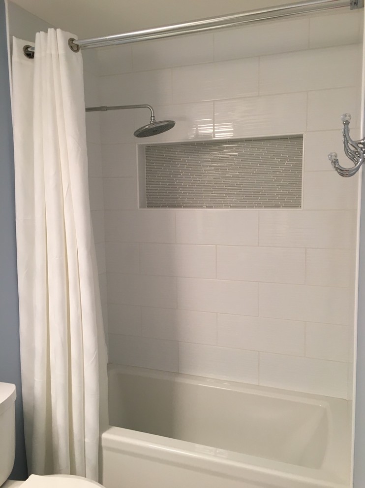 Bathroom - mid-sized transitional kids' porcelain tile and blue tile ceramic tile and beige floor bathroom idea in New York with a two-piece toilet, blue walls, shaker cabinets, white cabinets, an undermount sink and granite countertops