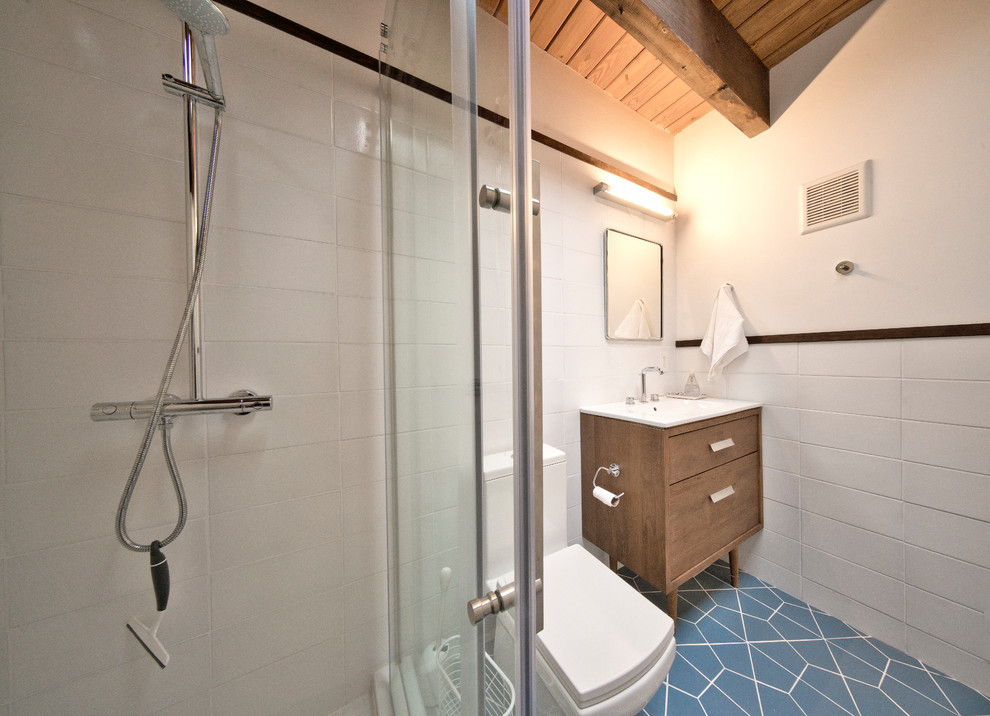 Bathroom - mid-sized 1960s master white tile and ceramic tile porcelain tile and blue floor bathroom idea in DC Metro with open cabinets, white cabinets, a two-piece toilet, white walls, a drop-in sink, quartzite countertops and white countertops