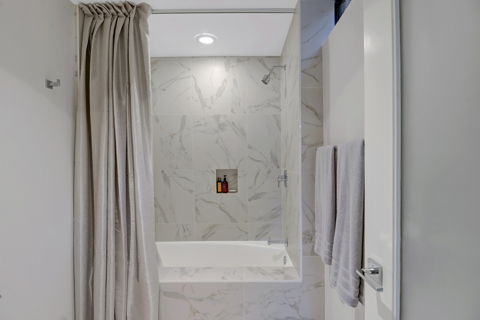 Bathroom - mid-sized contemporary master white tile and porcelain tile porcelain tile and white floor bathroom idea in Other with flat-panel cabinets, medium tone wood cabinets, an undermount tub, a two-piece toilet, white walls, an undermount sink and quartzite countertops