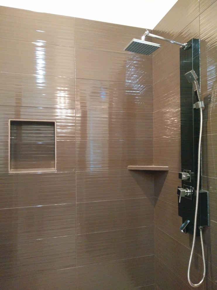 Inspiration for a large timeless master corner shower remodel in Houston
