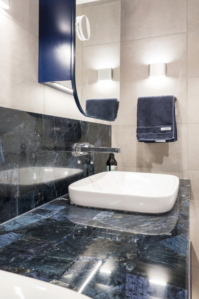 Photo of a small modern bathroom in Sydney with flat-panel cabinets, blue cabinets, a wall mounted toilet, beige tiles, porcelain tiles, beige walls, porcelain flooring, a vessel sink, quartz worktops, beige floors, an open shower, blue worktops, a single sink and a floating vanity unit.