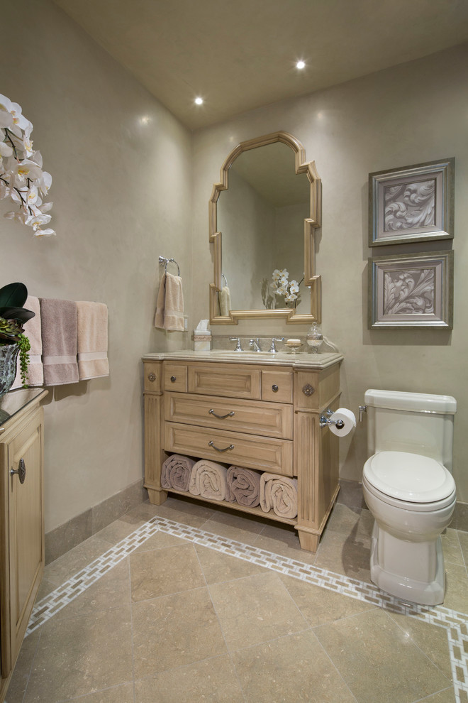 Photo of a medium sized traditional shower room bathroom in Orange County with a built-in sink, light wood cabinets, granite worktops, a built-in bath, beige tiles, beige walls, freestanding cabinets, a double shower, a two-piece toilet, stone tiles, limestone flooring, beige floors, a hinged door and beige worktops.