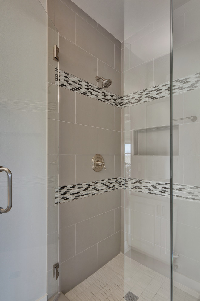This is an example of a large classic family bathroom in Austin with raised-panel cabinets, white cabinets, a corner shower, a two-piece toilet, grey tiles, mosaic tiles, grey walls, porcelain flooring, a submerged sink and marble worktops.