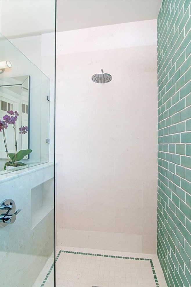Design ideas for a medium sized classic ensuite bathroom in San Diego with raised-panel cabinets, white cabinets, green tiles, glass tiles, white walls, limestone flooring, a submerged sink, engineered stone worktops, an alcove shower, a two-piece toilet, white floors and a hinged door.