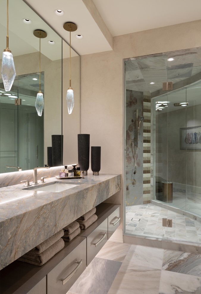 This is an example of a large contemporary ensuite bathroom in Miami with flat-panel cabinets, grey cabinets, a corner shower, multi-coloured tiles, glass tiles, grey walls, marble flooring, a built-in sink, granite worktops, multi-coloured floors, a hinged door and multi-coloured worktops.