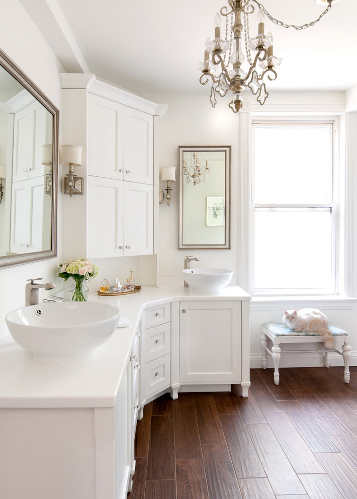 Inspiration for a transitional bathroom remodel in Toronto with solid surface countertops and a vessel sink