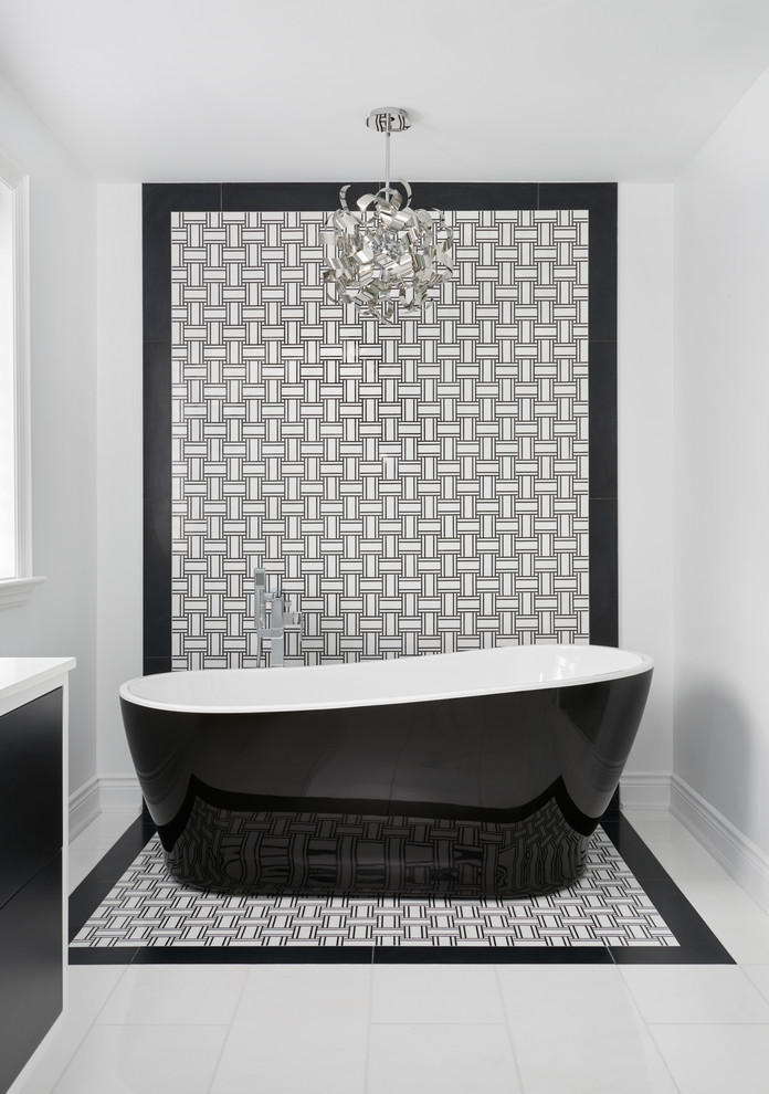 Inspiration for a large transitional master black and white tile and mosaic tile marble floor bathroom remodel in Toronto with flat-panel cabinets, black cabinets, white walls, an undermount sink and quartz countertops