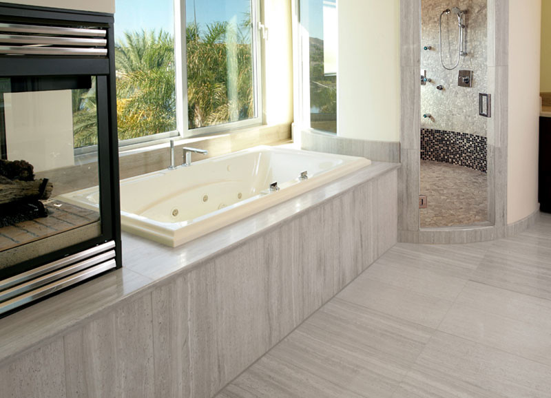Idées déco pour une grande salle de bain principale moderne avec une baignoire posée, une douche d'angle, un mur blanc, un sol en carrelage de céramique, un sol gris et une cabine de douche à porte battante.