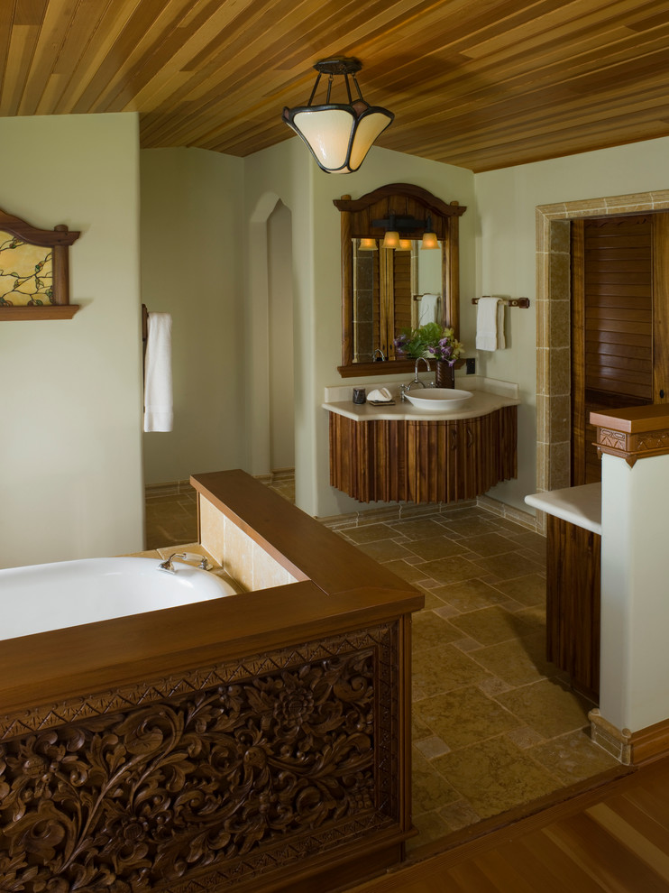 Example of an island style master bathroom design in Hawaii
