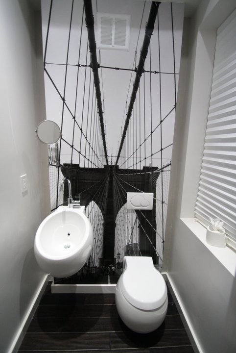 Bathroom - small modern dark wood floor bathroom idea in DC Metro with a one-piece toilet, white walls and a wall-mount sink