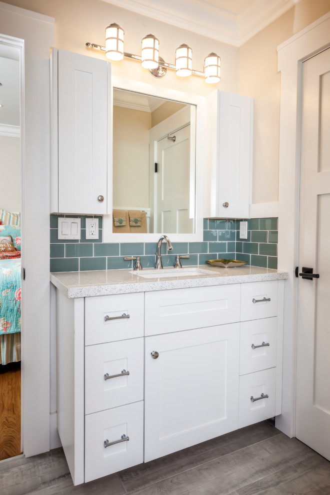 Bathroom - mid-sized coastal 3/4 blue tile and subway tile porcelain tile and brown floor bathroom idea in San Francisco with shaker cabinets, white cabinets, an undermount sink, quartz countertops, beige walls and a hinged shower door