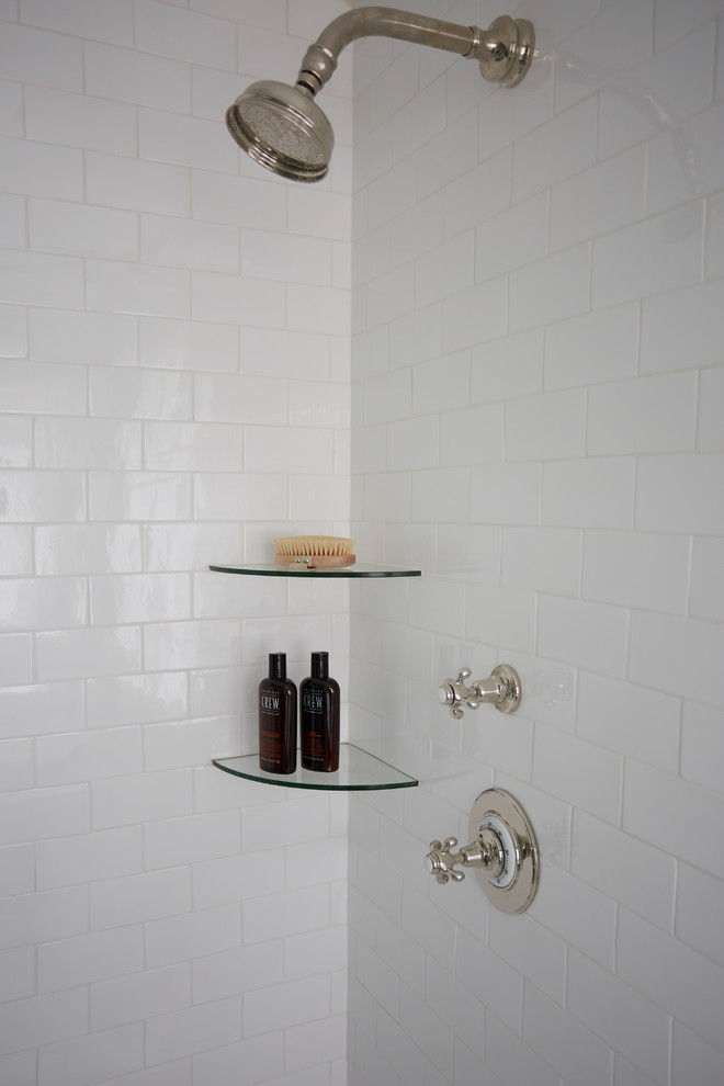 This is an example of a large contemporary ensuite bathroom in Chicago with a corner shower, white tiles, ceramic tiles and white walls.