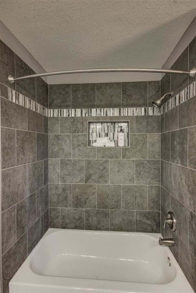 Photo of a large contemporary ensuite bathroom in Phoenix with shaker cabinets, white cabinets, a corner shower, black tiles, grey tiles, white tiles, porcelain tiles, grey walls, porcelain flooring, a submerged sink and granite worktops.