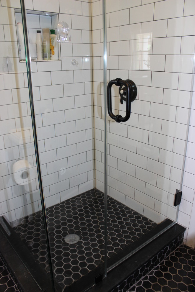 Example of a small minimalist master white tile and subway tile porcelain tile corner shower design in DC Metro with a two-piece toilet, blue walls, open cabinets and white cabinets
