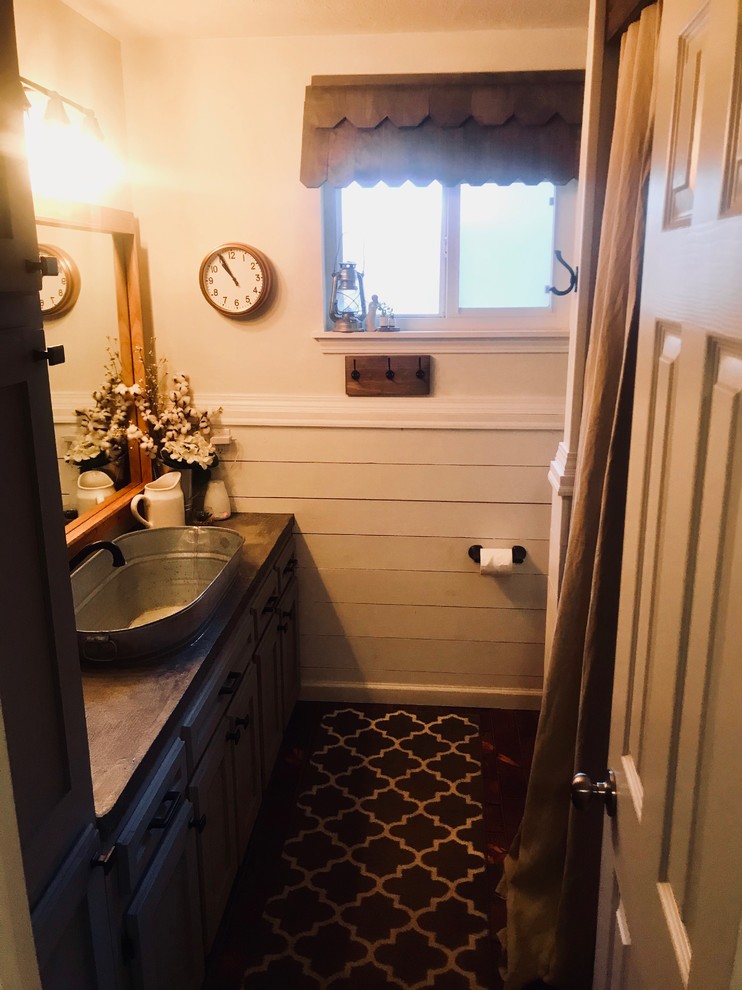 Photo of a medium sized rural family bathroom in Albuquerque with shaker cabinets, grey cabinets, a built-in bath, a shower/bath combination, white walls, concrete worktops, brown floors, a shower curtain and grey worktops.