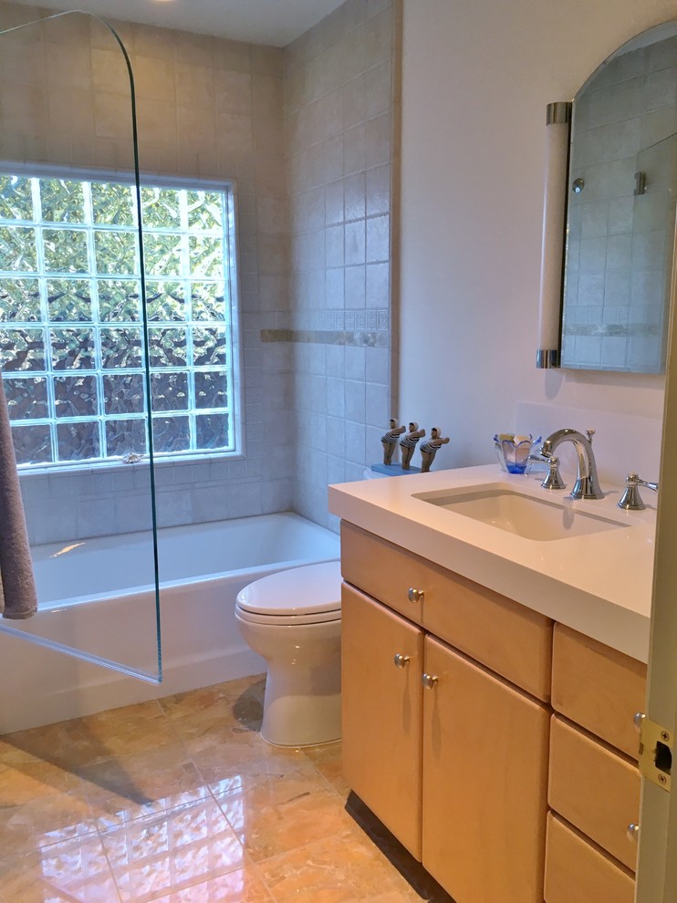 Example of a small transitional beige tile and ceramic tile marble floor bathroom design in San Francisco with an undermount sink, flat-panel cabinets, light wood cabinets, quartz countertops and beige walls