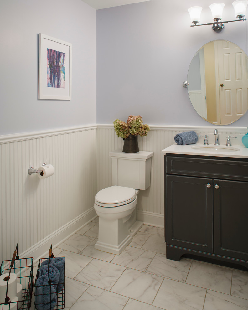 Example of a mid-sized classic kids' white tile and porcelain tile porcelain tile bathroom design in Philadelphia with an integrated sink, marble countertops, a two-piece toilet, purple walls, recessed-panel cabinets and gray cabinets