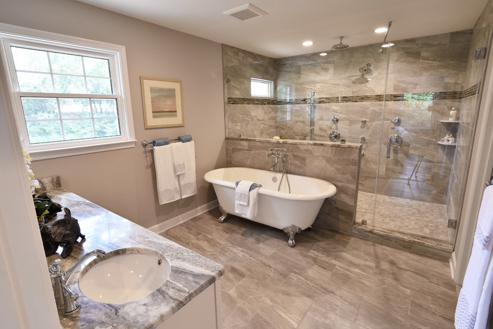 Mid-sized transitional master gray tile and porcelain tile porcelain tile claw-foot bathtub photo in DC Metro with recessed-panel cabinets, white cabinets, a two-piece toilet, gray walls, an undermount sink and granite countertops