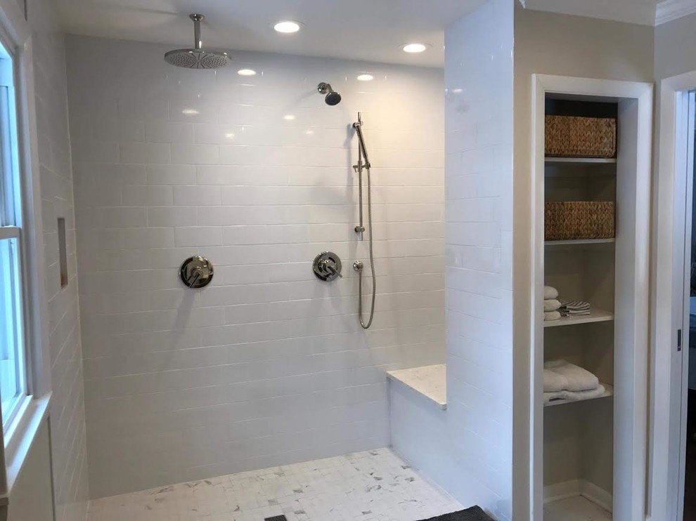 Inspiration for a medium sized traditional ensuite wet room bathroom in New York with beaded cabinets, medium wood cabinets, an alcove bath, white tiles, metro tiles, white walls, marble flooring, a submerged sink, marble worktops, white floors and an open shower.