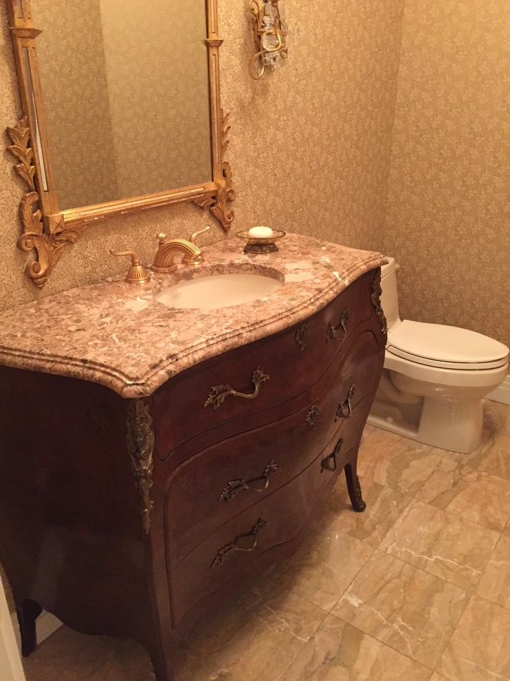 Photo of a victorian bathroom in New York with freestanding cabinets, dark wood cabinets, a two-piece toilet, beige tiles, grey tiles, white tiles, beige walls, marble flooring, a submerged sink and granite worktops.