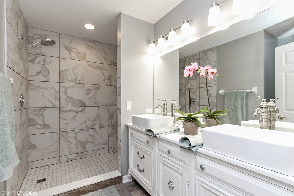Inspiration for a mid-sized transitional master white tile and porcelain tile porcelain tile and brown floor bathroom remodel in Chicago with furniture-like cabinets, white cabinets, a one-piece toilet, gray walls, a vessel sink and wood countertops
