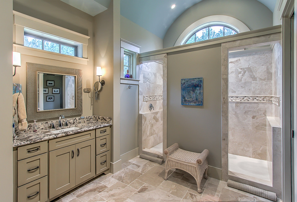Inspiration for a large craftsman master beige tile and stone tile ceramic tile alcove shower remodel in Atlanta with shaker cabinets, beige cabinets, beige walls, a drop-in sink and granite countertops