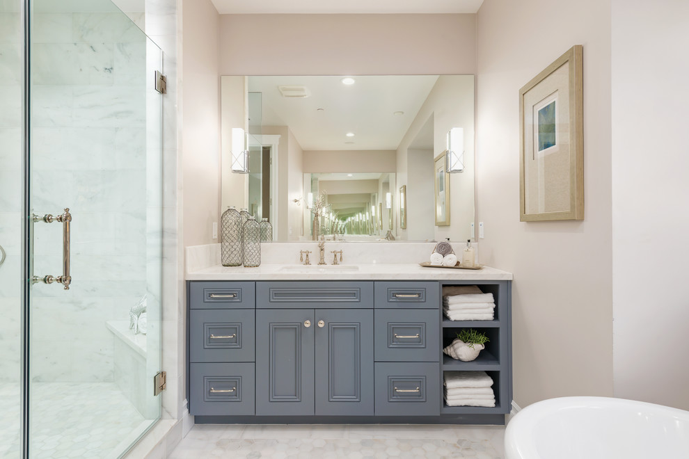 Example of a classic master mosaic tile mosaic tile floor bathroom design in San Francisco with recessed-panel cabinets, blue cabinets, a two-piece toilet, gray walls, an undermount sink and quartz countertops