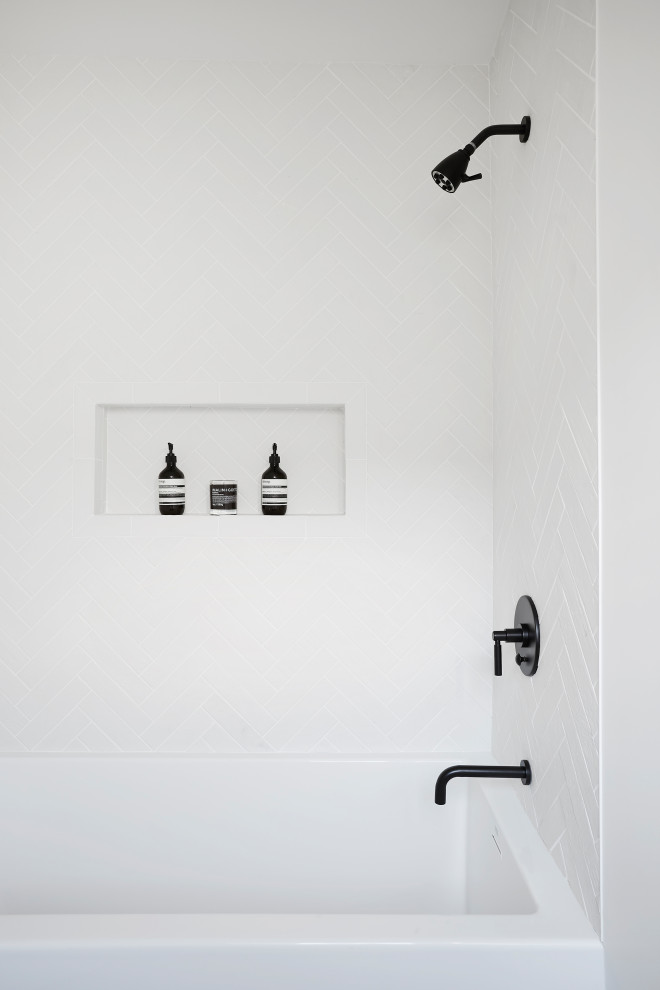 Photo of a medium sized modern family bathroom in Los Angeles with flat-panel cabinets, dark wood cabinets, a built-in bath, a shower/bath combination, a two-piece toilet, white tiles, ceramic tiles, grey walls, concrete flooring, an integrated sink, solid surface worktops, grey floors, an open shower and white worktops.