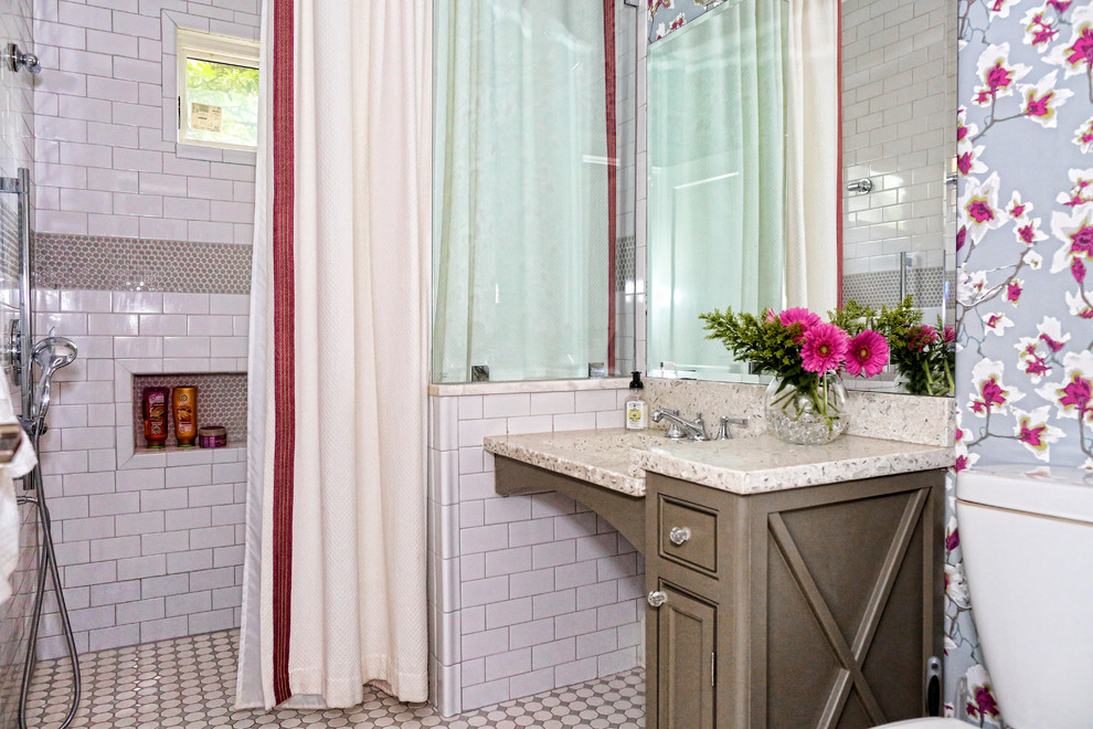 Photo of a small classic bathroom in Atlanta with shaker cabinets, grey cabinets, a built-in shower, a two-piece toilet, white tiles, ceramic tiles, multi-coloured walls, ceramic flooring, an integrated sink, terrazzo worktops, grey floors and a shower curtain.