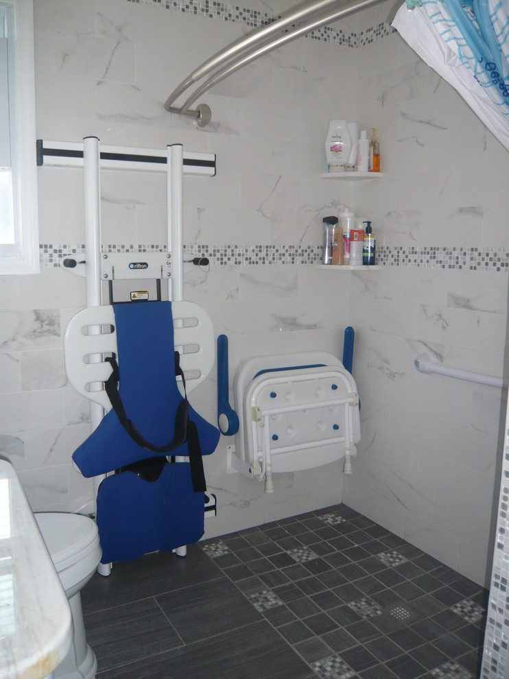 Photo of a medium sized modern ensuite bathroom in New York with flat-panel cabinets, white cabinets, a walk-in shower, a two-piece toilet, white tiles, porcelain tiles, white walls, porcelain flooring, a submerged sink and granite worktops.