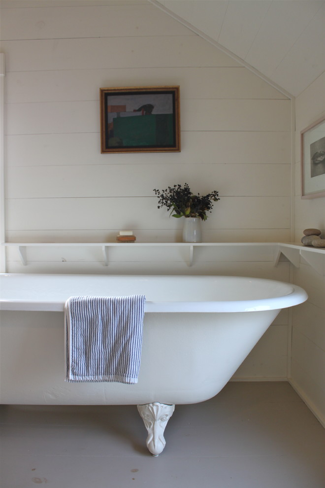 Inspiration for a rustic claw-foot bathtub remodel in Portland Maine