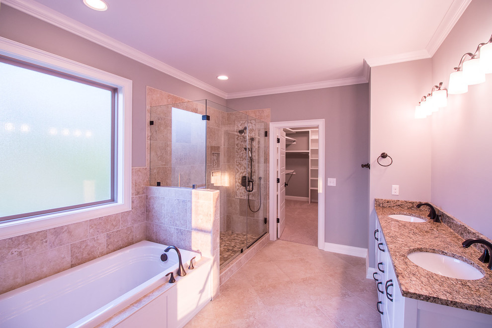 This is an example of a medium sized classic ensuite bathroom in Other with white cabinets, a built-in bath, a corner shower, travertine tiles, grey walls, travertine flooring, a submerged sink, granite worktops, beige floors, a hinged door, brown worktops and raised-panel cabinets.