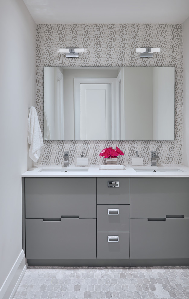 Bathroom - mid-sized contemporary gray tile and ceramic tile mosaic tile floor and gray floor bathroom idea in Toronto with flat-panel cabinets, gray cabinets, white walls, an undermount sink and quartz countertops