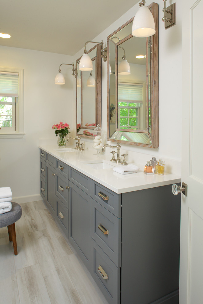 Medium sized classic ensuite bathroom in New York with recessed-panel cabinets, grey cabinets, white walls, a submerged sink, grey floors, porcelain flooring and engineered stone worktops.