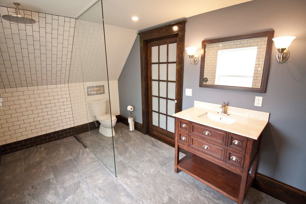 Photo of a medium sized contemporary ensuite bathroom in Other with open cabinets, light wood cabinets, a built-in shower, a one-piece toilet, white tiles, ceramic tiles, blue walls, ceramic flooring, an integrated sink, solid surface worktops, grey floors and an open shower.