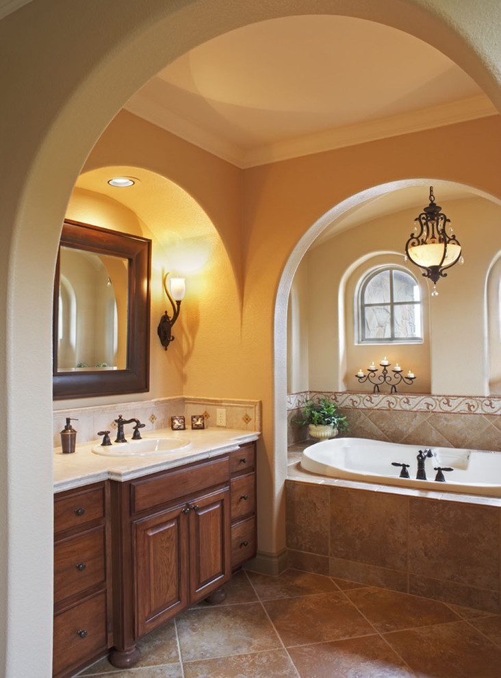 This is an example of a mediterranean bathroom in Austin with mosaic tiles.