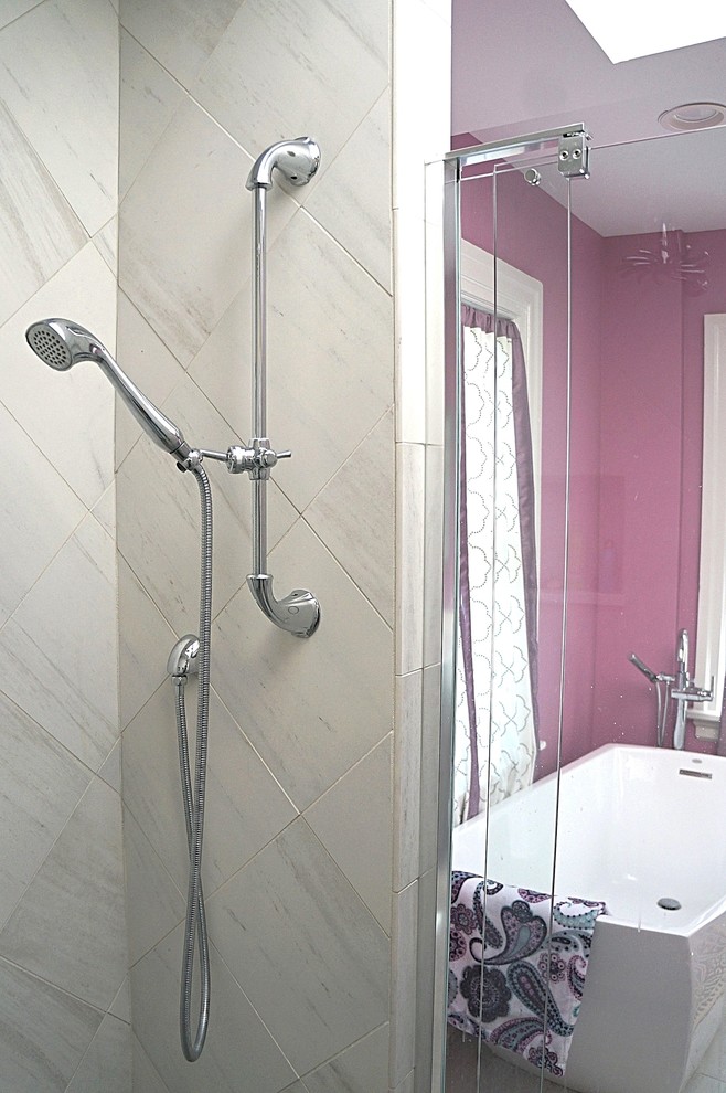 Photo of a medium sized traditional ensuite bathroom in Philadelphia with a freestanding bath, a double shower, grey tiles, porcelain tiles, porcelain flooring, grey floors, a hinged door and pink walls.