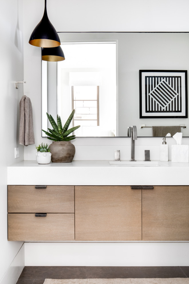 Inspiration for a contemporary gray floor bathroom remodel in Orange County with flat-panel cabinets, medium tone wood cabinets, an undermount sink, white countertops and a floating vanity