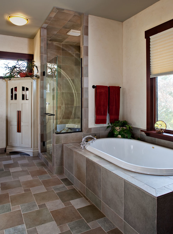 Example of a trendy beige tile and stone slab bathroom design in Kansas City